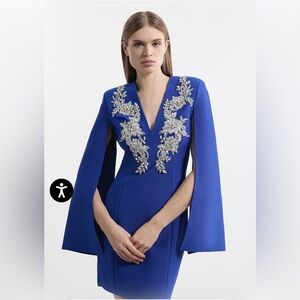 Bandage Form Fitting Cape Sleeve Embellished Mini Dress